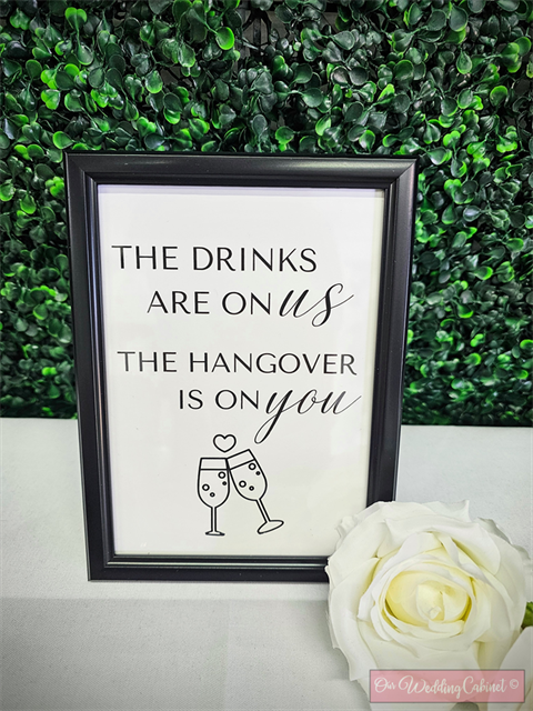 5"x7" Black Frame "The Drinks Are On Us" Sign