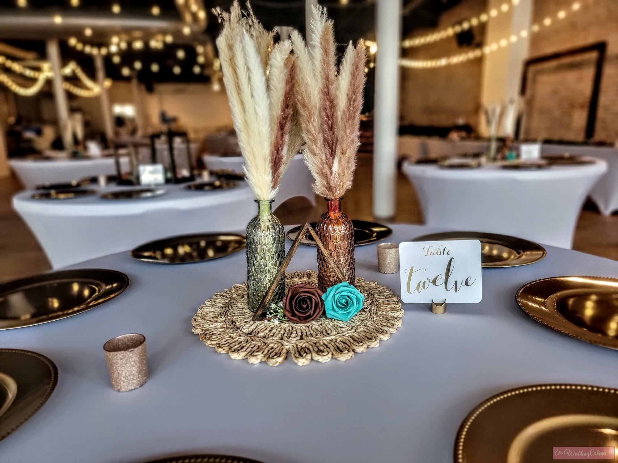 Wedding centerpiece rental ideas with lanterns and greenery