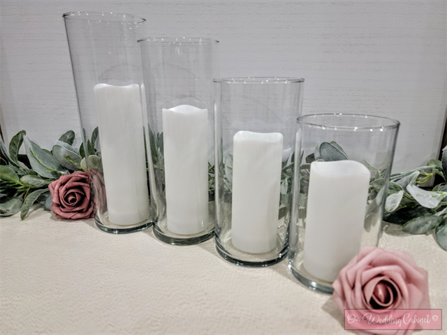 White Pillar Candle (7" Battery Operated, requires x2 AA Batteries that we will include, but can not guarantee longevity) *** THIS CANDLE SIZE GOES BEST WITH THE 10" HURRICANE VASES ***